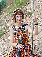 With spear wearing in colorful dress