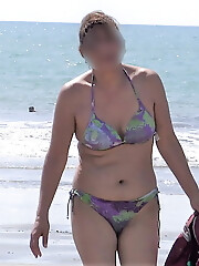 My hairy wife on the beach, watch her videos too
